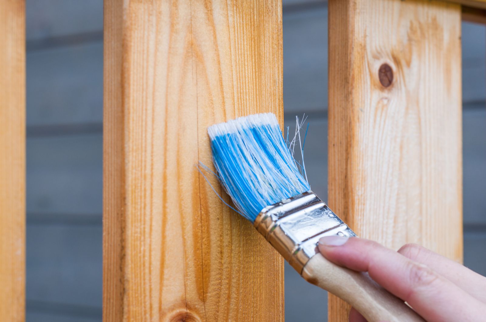 Brushing sealer onto a wooden board