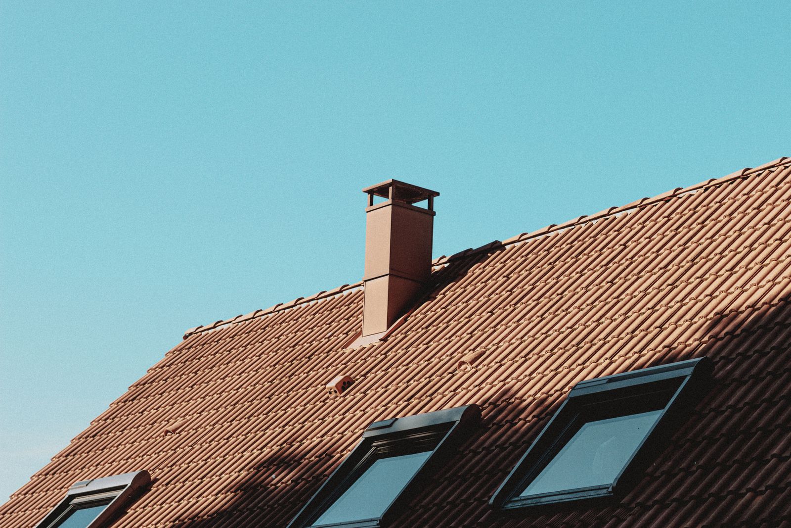 Tiled roof of a residential home in sunlight